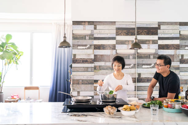 istock Chinese couple cooking in the kitchen 1180380972