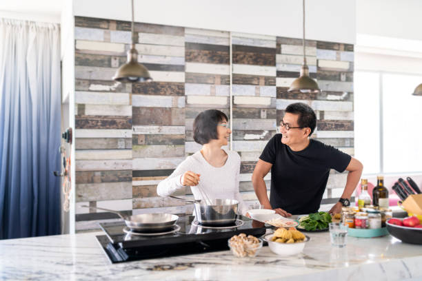 istock Chinese couple cooking in the kitchen 1180381121