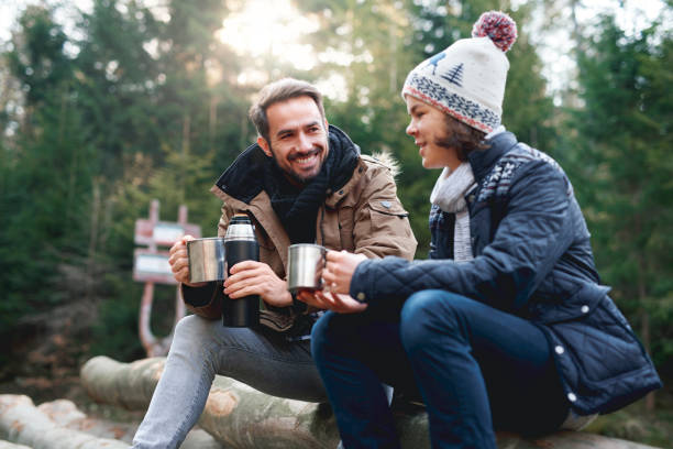 istock Happy dad and his son drinking tea in autumn forest 1180381261