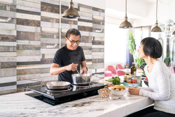 istock Chinese couple in the kitchen 1180381532