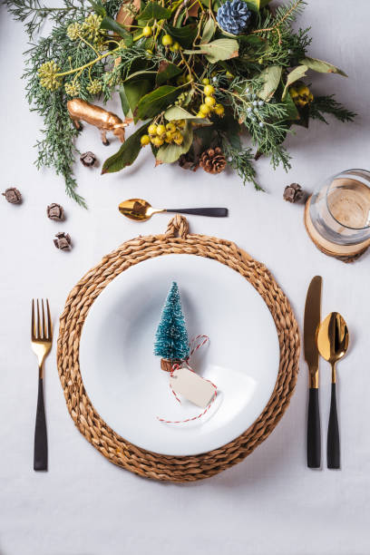 istock Elegant Christmas place settings, Pine tree figurine on the dish from above 1180382784