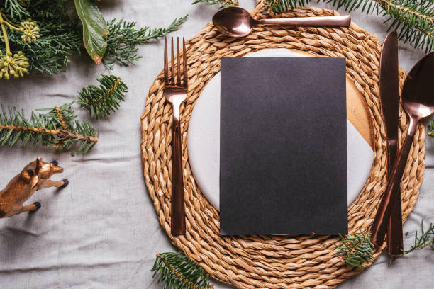 istock menu place setting with empty card and golden cutlery 1180382810