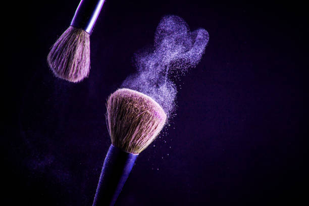 istock Makeup brush with pink on the black background 1180384422