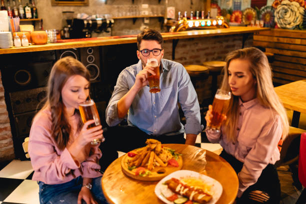 istock Friends on beer and pub food 1180384706