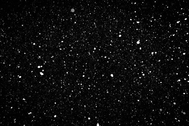 istock Snow isolated on the black background 1180384728