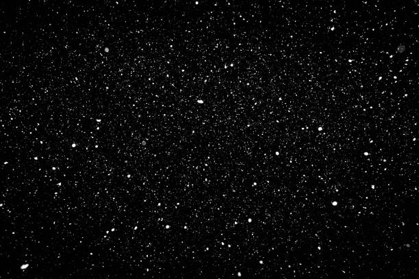 istock Snow isolated on the black background 1180384772