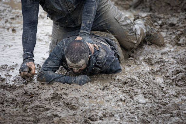 istock Krav Maga military muddy fighting duo 1180386011