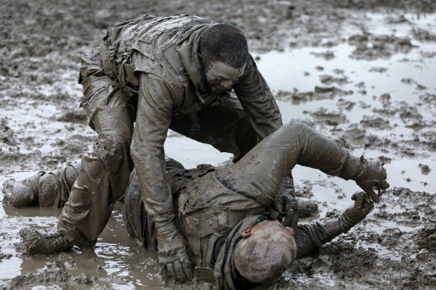 istock Krav Maga military muddy fighting duo 1180386427