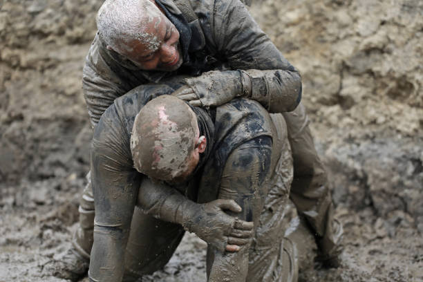 istock Krav Maga military muddy fighting duo 1180386440