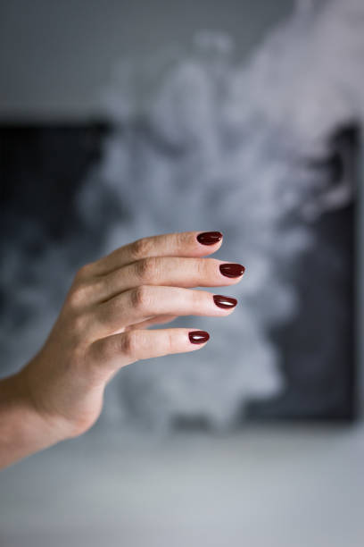 istock manicure disinfection with spray on a gray background 1180386627