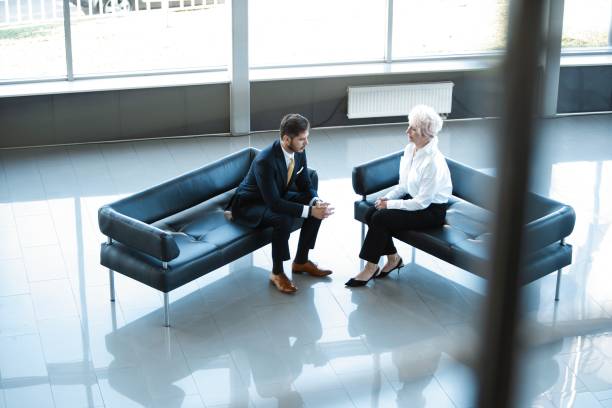istock Positive business colleagues enjoying informal talk during work break. 1180387418