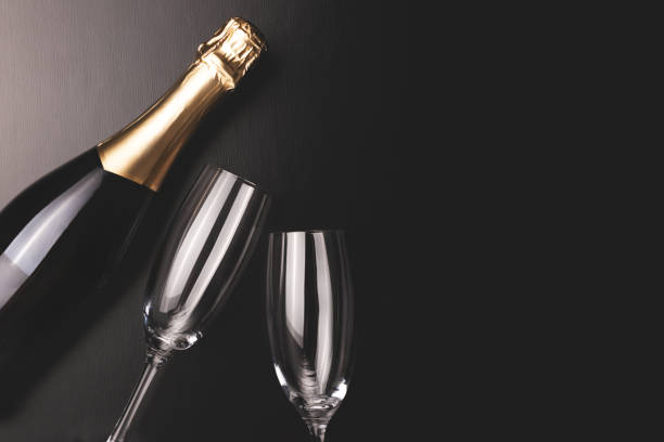 istock Minimal composition with champagne bottle and two glasses. 1180390126