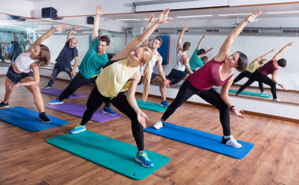 istock Happy adults having group fitness class 1180392978