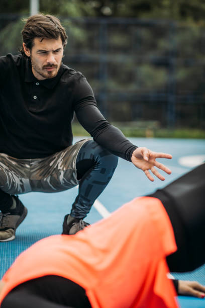 istock Training Outdoors with Personal Fitness Coach 1180393762