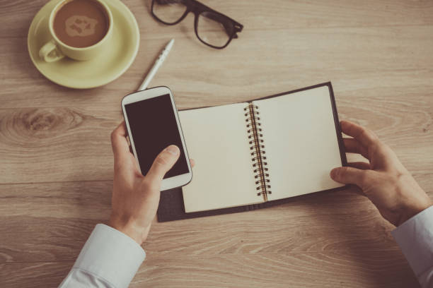 istock Businessman in his office using mobile phone 1180393980