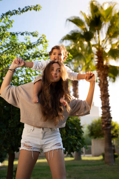 istock little brother and sister having fun sunny day 1180394029