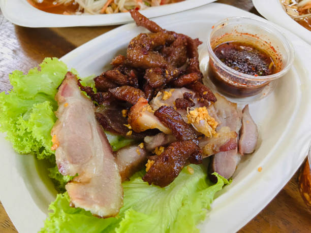 istock Dish of deep fried marinated pork served with Thai spicy sauce. 1180396537