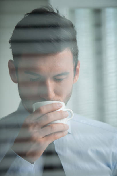 istock Businessman enjoying a cup of coffee 1180399481