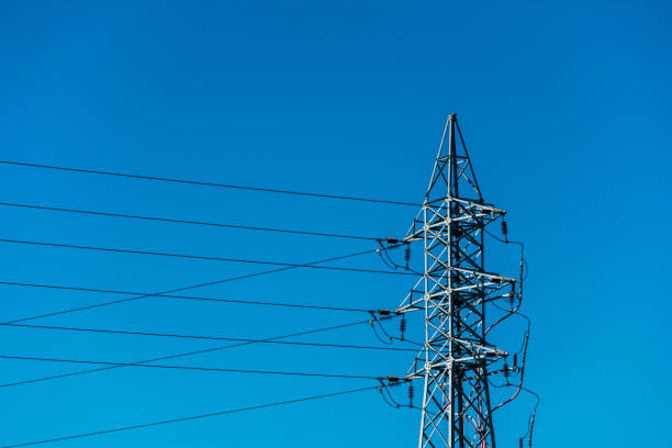 istock high voltage electrical tower with wires over blue sky 1180400680