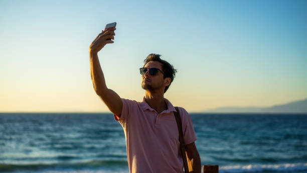 istock man taking selfie photo 1180402953