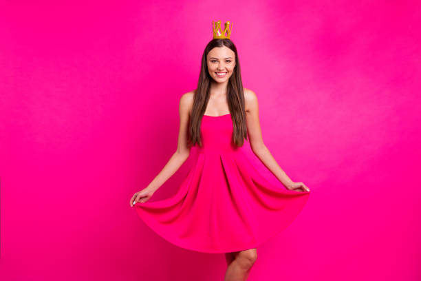 Portrait of her she nice-looking attractive lovely gorgeous cheerful cheery long-haired girl wearing crown dress posing isolated on bright vivid shine vibrant pink fuchsia color background Portrait of her she nice-looking attractive lovely gorgeous cheerful cheery long-haired girl wearing, crown dress posing isolated on bright vivid shine vibrant pink fuchsia color background prom queen stock pictures, royalty-free photos & images