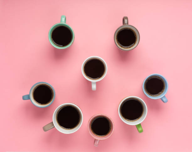 istock Coffee in the different cups on the pink background. Flatlay, cheerful day concept 1180404565