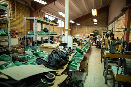 Shoe factory with equipment  and machines used for making shoes, without employee