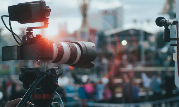 istock Professional event shooting, digital camera with large lens, 1180406124