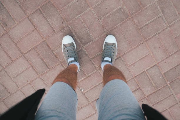 istock Young guy in sneakers and shorts, urban style, 1180406158