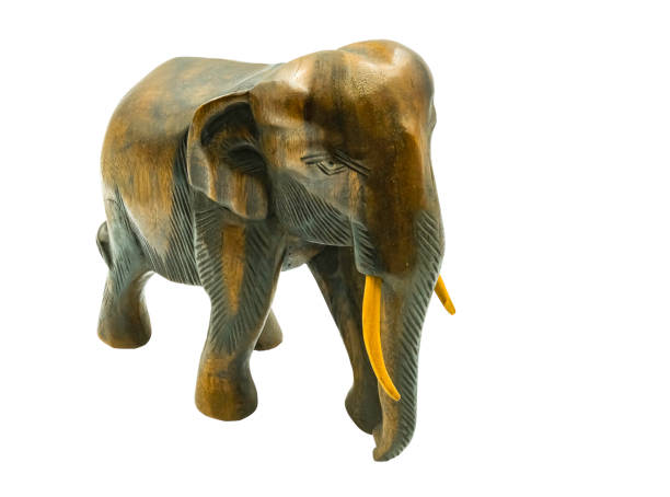 istock Thai elephant wooden texture carve isolated on white background with clipping path 1180407603