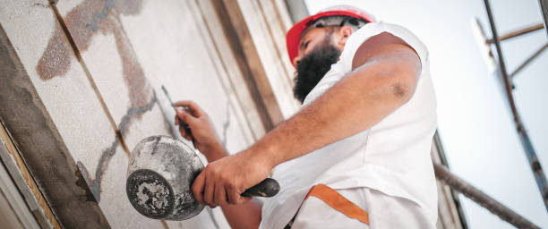 istock Construction mason worker mixing cement and sand with spatula 1180408436