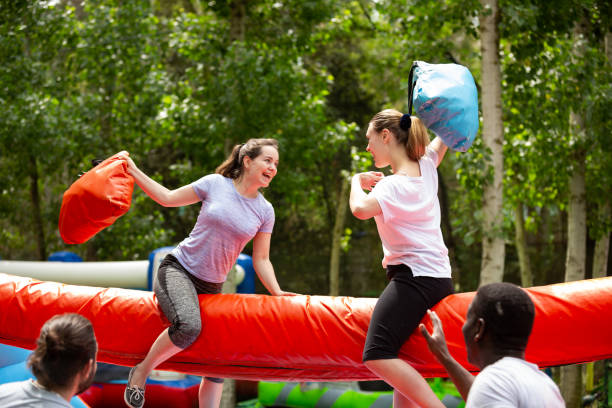 istock Women on inflatable pillow fight arena 1180408529
