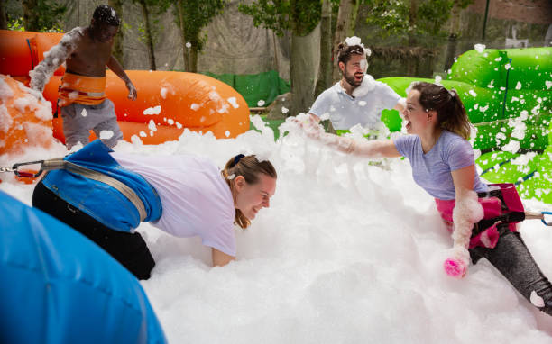 istock Team collecting balls in inflatable foam pool 1180408552