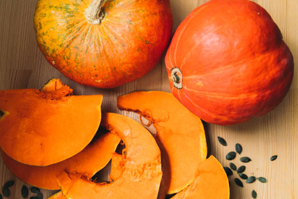 istock Pumpkins and seeds on the table background 1180409555
