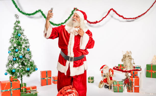 istock Santa Claus taking selfies 1180409872