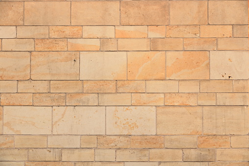 A Vintage grunge sandstone blocks wall texture.