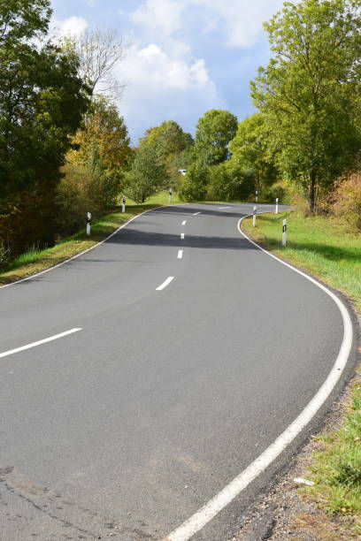 istock autumn road in rural Eifel 1180411870