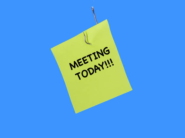 istock Post it with the words meeting today as a reminder for urgency and importance. 1180411947