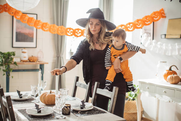 istock Decorating home for Halloween with baby 1180412037