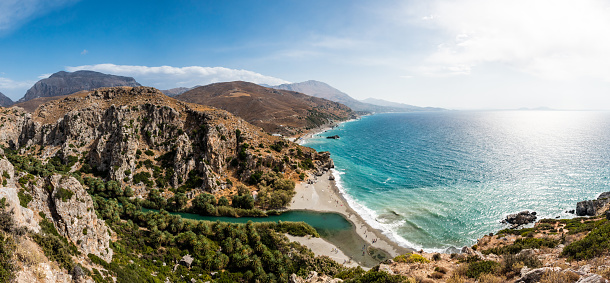 View of Preveli Beach with river and palm trees, south coast of Crete, Mediterranean Sea, Greece