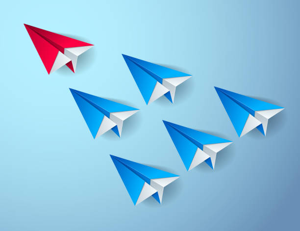 istock Leadership concept visualized with origami folded plane toys one of them is flying in the front and leading the team group, vector modern style 3d illustration. 1180415422