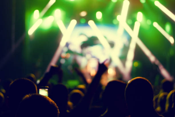 istock Silhouettes of concert crowd. 1180415510