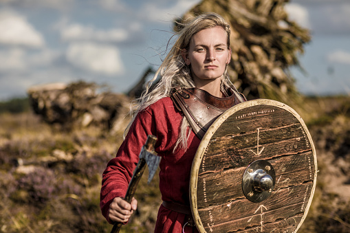 An individual viking female warrior outdoors