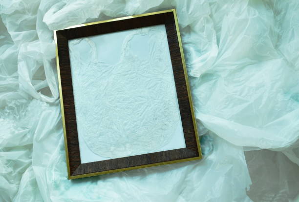 istock close up of wooden picture frame on white plastic bag packing stacking 1180418221