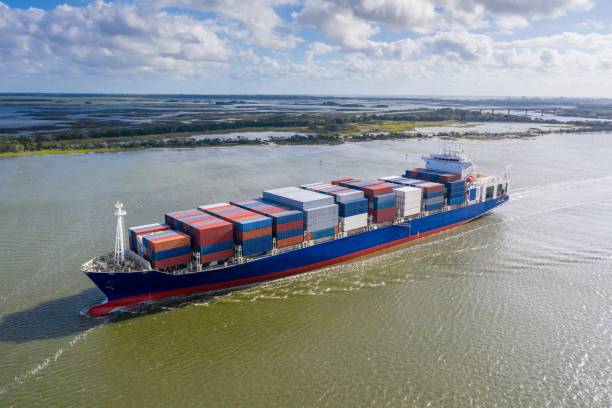 istock Large container ship entering / leaving port. 1180419223