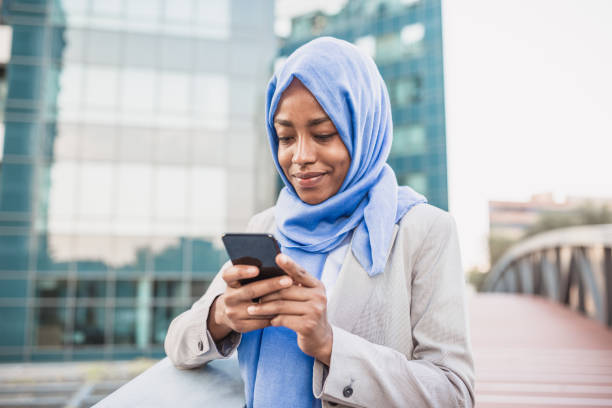 istock Muslim businesswoman using phone 1180419650