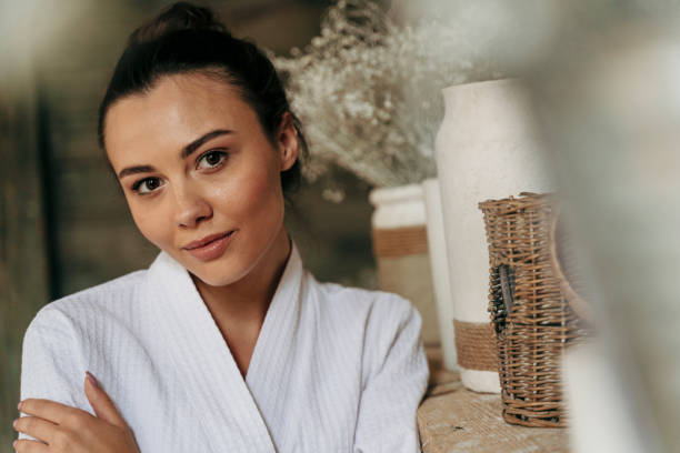 istock Beautiful young lady is posing at camera at home 1180420654
