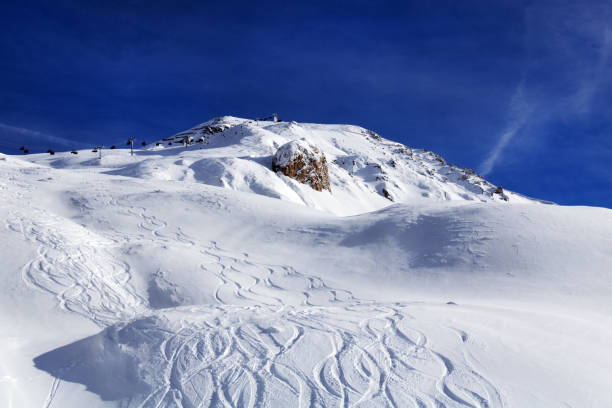 Ski slopes in winter sunny day. stock photo