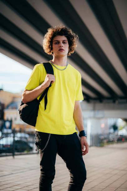 istock Young man with backpack outdoors stock photo 1180425922