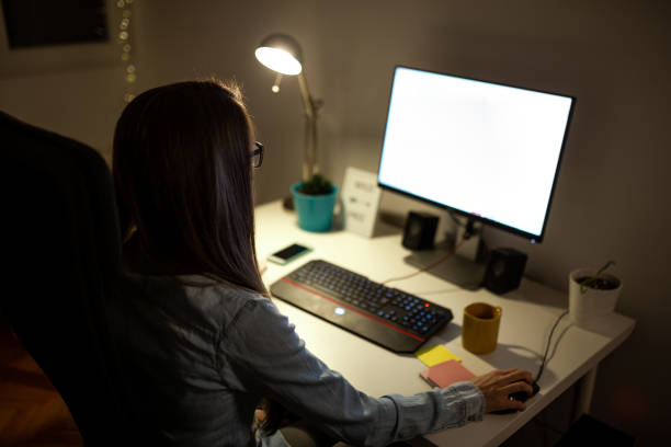istock Woman working late at her home office 1180426876